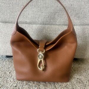 Dooney & Bourke Shoulder Logo Lock Sack with Gold Hardware.